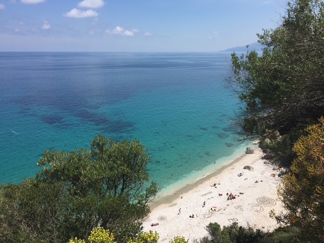 Overlooking a secluded beach and the sea