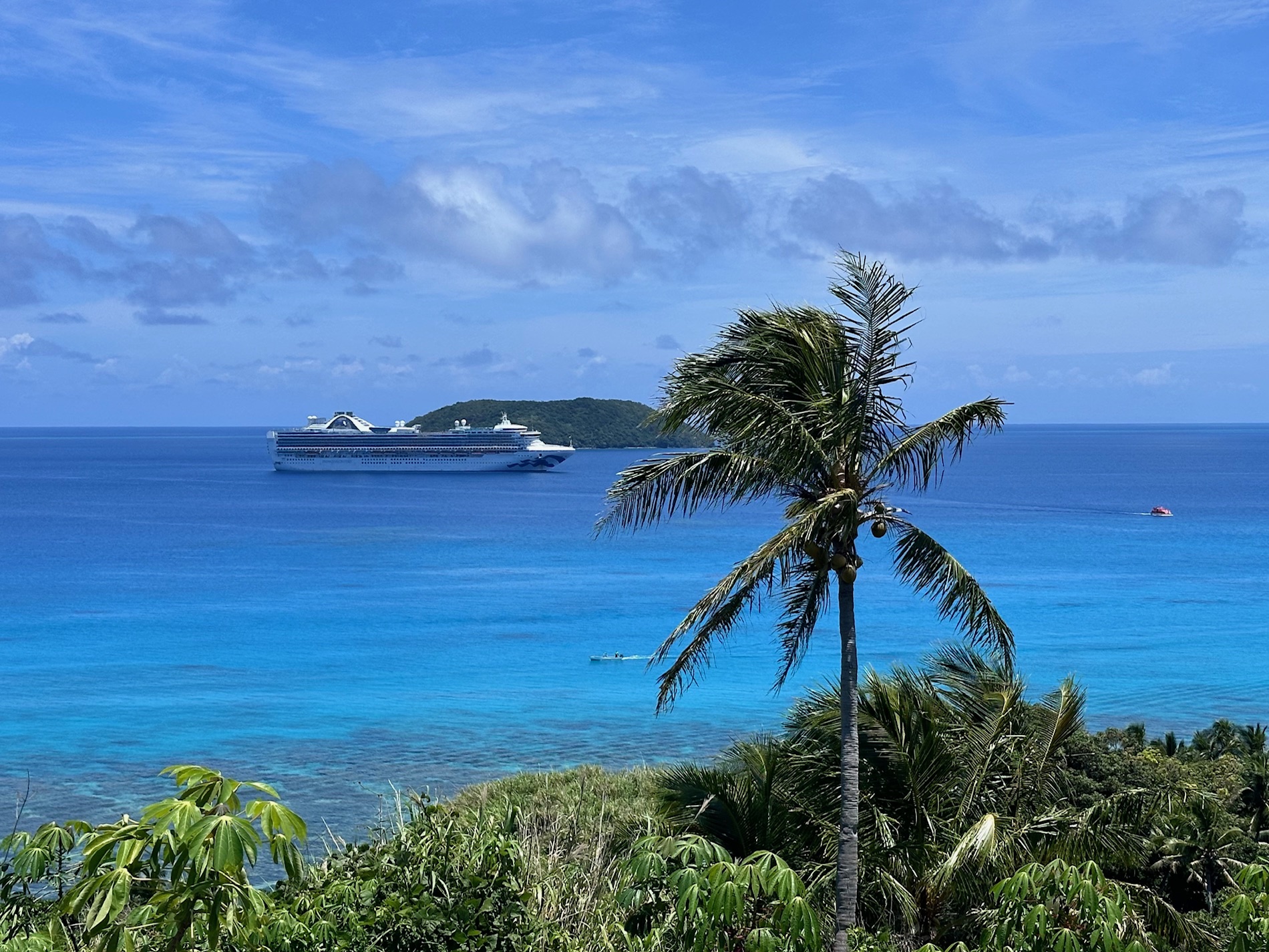 A cruise ship in the distance from a French Polynesian island